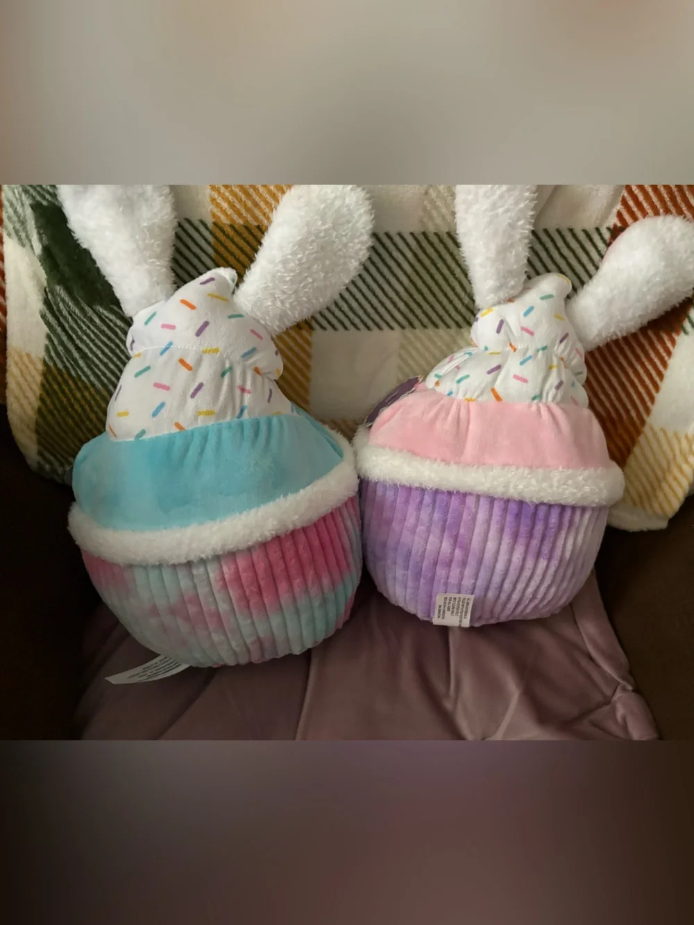 Two Plush cupcakes . 13in height 20 in round , pastel colors , multi / solid